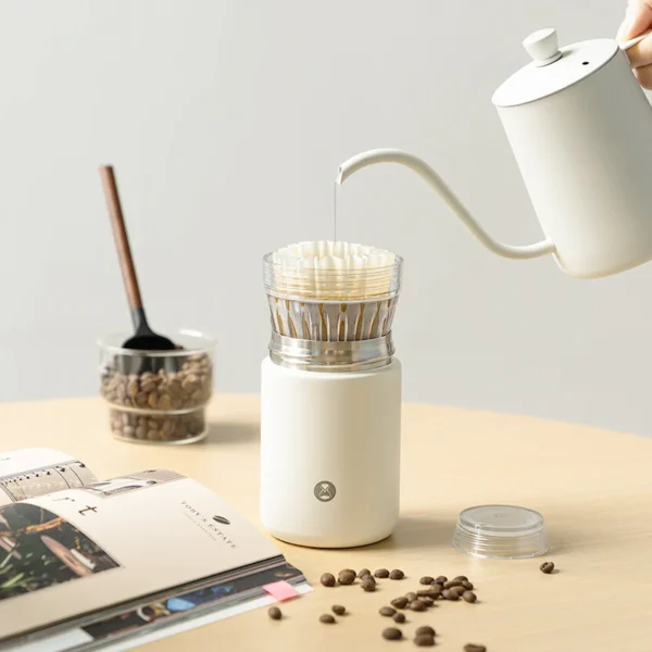 Timemore Crystal Eye Vacuum Travel Brewer brewing coffee on the go